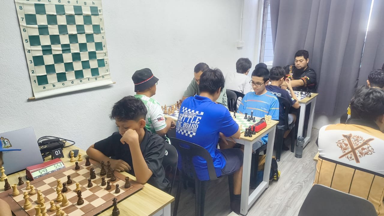 Youth chess tournament hall with many OTB boards in play