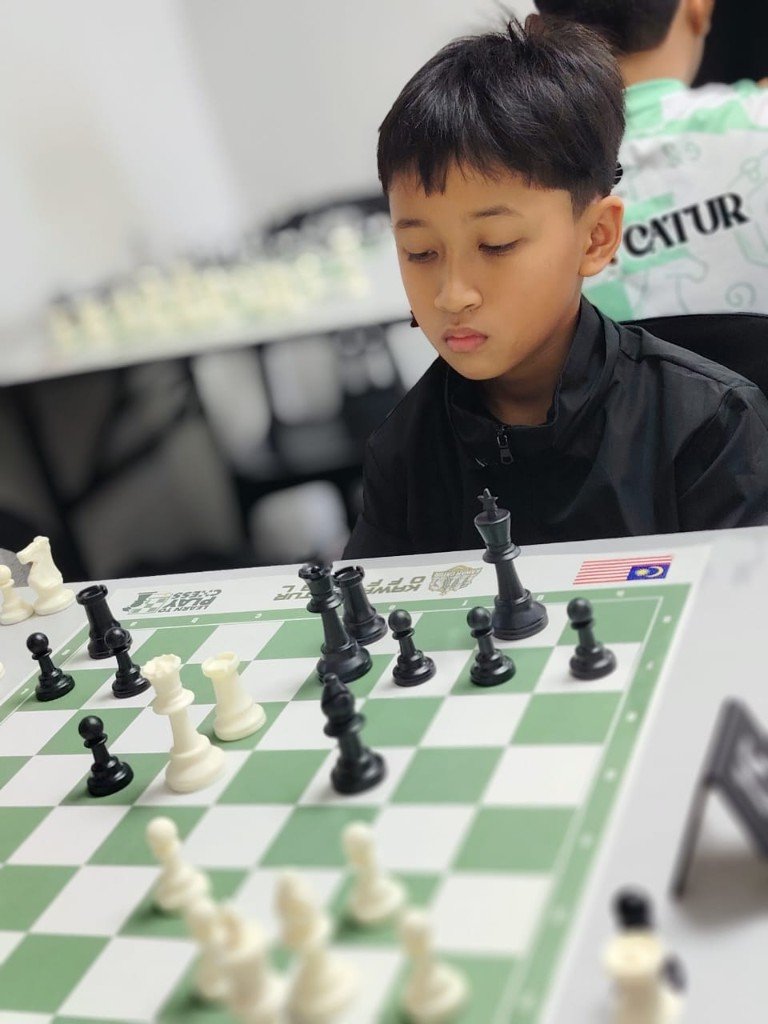 Junior player concentrating at an OTB game