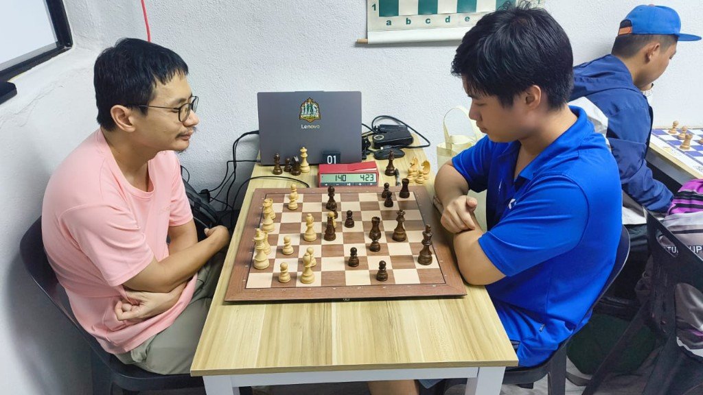 OTB chess match with laptop ready for digital recording